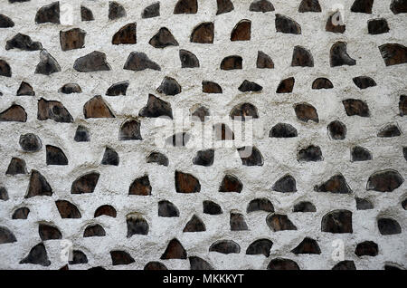 White walls and wooden piles, for texture or background, close up Stock Photo