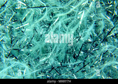 image abstract background of shiny blue and white tinsel and glitter Stock Photo
