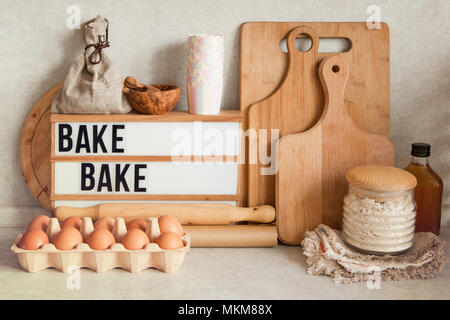 Baking or cooking ingredients, kitchen items for baking cakes. Kitchen utensils, flour, eggs, almond, cinnamon, butter, sugar, rum. Pastry making and  Stock Photo