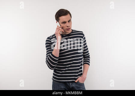 Handsome young man making a call Stock Photo