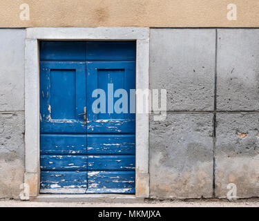 Old weathered blue door made of wood in Croatia (Island Cres) Stock Photo