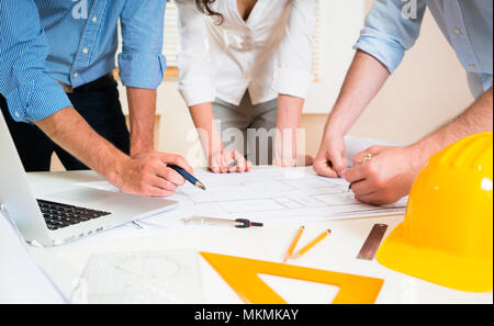 Discussion of construction plans in architects office Stock Photo