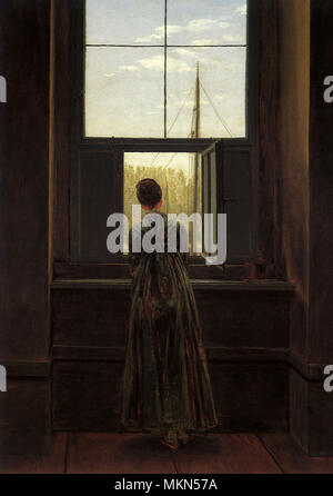 Woman at Window Stock Photo