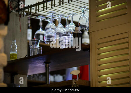 Suspended glasses in a bar, glasses for wine and champagne Stock Photo