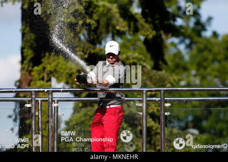 Rory McIlroy wins the BMW PGA Championship and celebrates with champagne spray during the 2014 European Tour of the BMW PGA Championship at Wentworth Golf Club, Virginia Water, Surrey, England. 25 May 2014 --- Image by © Paul Cunningham Stock Photo