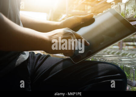 hand tablet  man working using a digital tablet  laptop computer Stock Photo