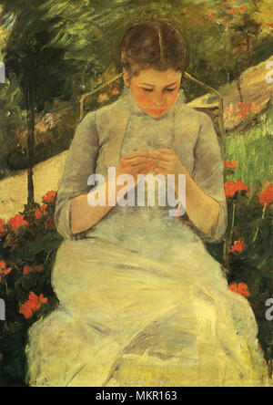 Young Woman Sewing in the Garden Stock Photo