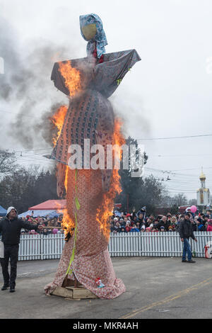 TIRASPOL, MOLDOVA - FEBRUARY 18, 2018: Rite of burning stuffed Maslenitsa. The slavonic pagan holiday Maslenitsa (Shrovetide) - a symbolic meeting of  Stock Photo
