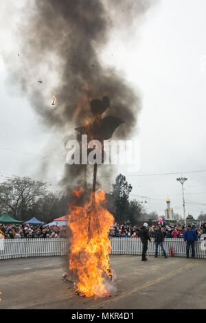 TIRASPOL, MOLDOVA - FEBRUARY 18, 2018: Rite of burning stuffed Maslenitsa. The slavonic pagan holiday Maslenitsa (Shrovetide) - a symbolic meeting of  Stock Photo