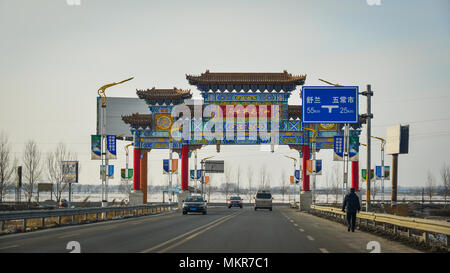 Harbin, China - Feb 25, 2018. Chinese gate on highway in Harbin, China. Harbin is the capital of Heilongjiang province, Northeastern China. Stock Photo