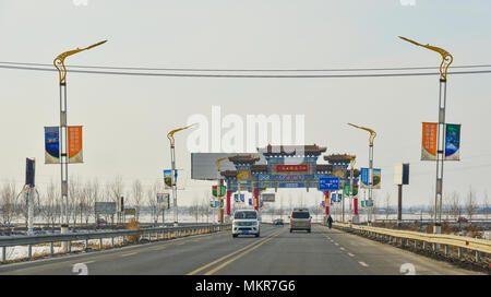 Harbin, China - Feb 25, 2018. Chinese gate on highway in Harbin, China. Harbin is the capital of Heilongjiang province, Northeastern China. Stock Photo