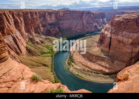 Horseshoe Bend - Overview of Colorado River at Horseshoe Bend on a cloudy spring evening. Page, Arizona, USA. Stock Photo