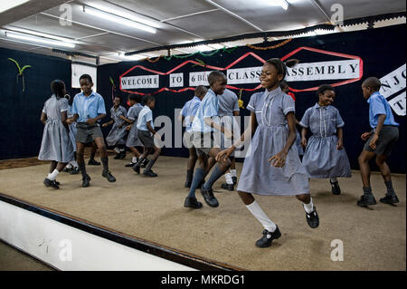 School pupils in Zambia performing on stage in assembly. Stock Photo