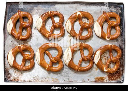 pretzels on baking sheet isolated on white background Stock Photo