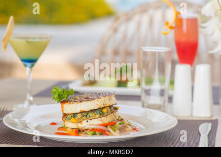 A plate of vegetarian burger at a high end outside restaurant Stock Photo