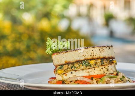 A plate of vegetarian burger at a high end outside restaurant Stock Photo
