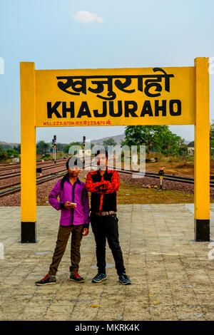 Kids standing before Khajuraho Sign board Madhyapradesh, India Stock Photo