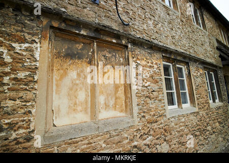 windows blocked up to avoid the window tax where the phrase daylight robbery comes from Lacock village wiltshire england uk Stock Photo