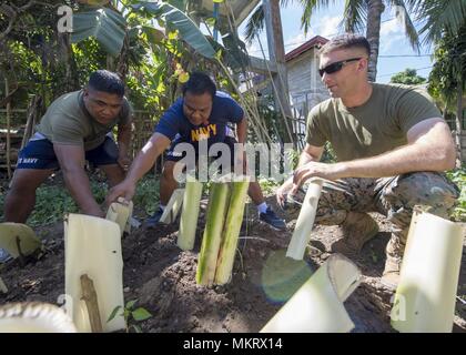 U.S. Marine Corps 1st Lt. Mark Hanford, civil affairs officer, attached to III Marine Expeditionary Force, builds a garden with members of the Armed Forces Philippine Navy during Exercise Balikatan at Luga Elementary School Santa Teresita, Cagayan, Philippines, May 6, 2018, May 6, 2018. Exercise Balikatan, in its 34th iteration, is an annual U.S.-Philippine military training exercise focused on a variety of missions, including humanitarian assistance and disaster relief, counterterrorism, and other combined military operations held from May 7 to May 18. (U.S. Navy photo by Mass Communication S Stock Photo