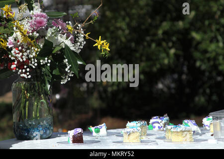 Cake and flowers during simple wedding Stock Photo