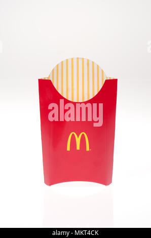 Empty Mcdonald’s french fries container on white background Stock Photo