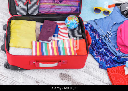 Suitcase with things on the floor. Stock Photo