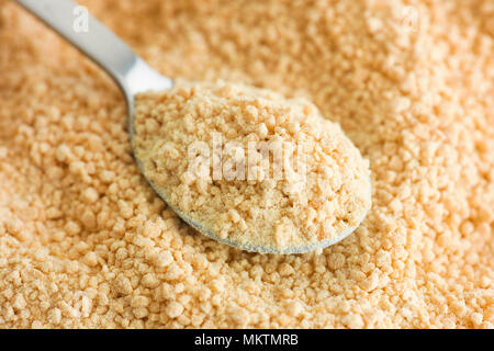 Soy lecithin in a tea spoon. Close up. Stock Photo