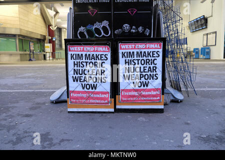 Evening Standard newspaper poster advert 'Kim Makes Historic Nuclear Weapons Vow'  outside a street news seller newsstand 28 April 2018 in London UK Stock Photo