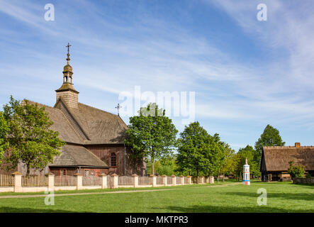 Traditional old polish countryside wooden catholic church. Open air museum in Dziekanowice. Poland. Stock Photo