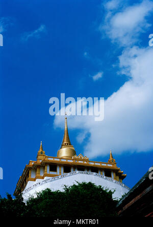 Golden Mount - Buddhist shrine of Wat Saket Ratcha Wora Maha Wihan Golden Mountain Temple in Bangkok in Thailand in Southeast Asia Far East. Sky Stock Photo