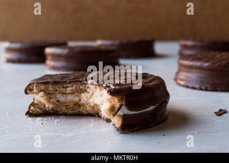 Stack of Bitten Chocolate Covered Marshmallow Biscuits. Dessert Concept. Stock Photo