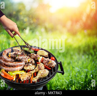 Picnic In Countryside - Barbecue Grill With Vegetable And Meat Stock Photo