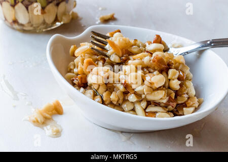 Honey Flavored Nuts, Almonds and Peanut Brittle Dessert. Organic Food. Stock Photo