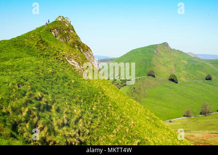 Walkers on Parkhouse Hill in the Peak District National Park with Chrome Hill in the distance Stock Photo