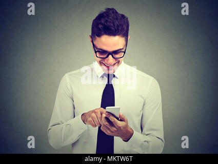 Handsome happy business man using mobile phone Stock Photo