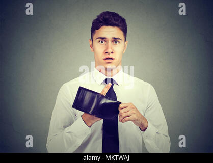 Man with no money. Businessman holding empty wallet Stock Photo
