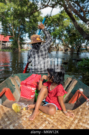 Mother and child in a rowing boat, Kompong Phluk Floating Village, Tonle Sap Lake, Cambodia Stock Photo