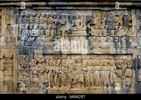 Magnificent two story panel in tone bas-relief carving Borobudur 9th century Buddhist Temple Java Indonesia Stock Photo