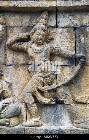 Stone bas-relief carving archer with drawn bow figure Borobudur 9th century Buddhist Temple Java Indonesia Stock Photo