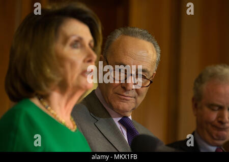 Senate Minority Leader Charles Schumer (D-NY) looks on as Democratic Minority Leader Nancy Pelosi (D-CA) holds a press conference on President Donald Trump's 100th day in office on April 18th, 2017 at the U.S. Capitol in Washington, D.C. Stock Photo