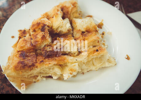 Balkan Bakery Breakfast Serving of Byrek me Gjizë (Cheese Pie with Feta & Flaky Filo Pastry) Burek Stock Photo