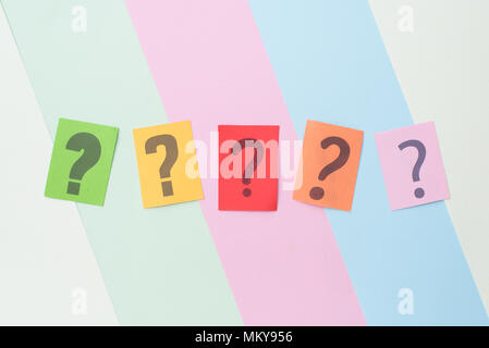 colorful paper with QUESTION MARK on multicolored pastel color background. FAQ,Q&A,Mystery and questions concept Stock Photo