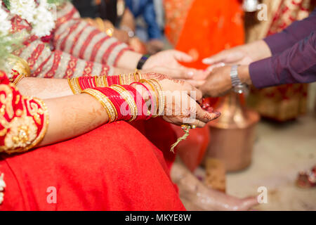 Hindu Nepali Bride and groom's Hands on the wedding day. Stock Photo