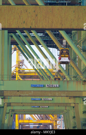 Vertical view of cranes loading and unloading container ships at a deep ...