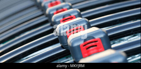 Close up of shopping carts with coin operated lock lined up in a row ready for use. Stock Photo