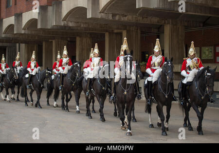 Hyde Park Barracks, London, UK. 9 May, 2018. Behind-the-scenes ‘Day in the Life of the Household Cavalry Mounted Regiment’. Prince Harry joined The Blues and Royals in April 2006 and served with the Household Cavalry Regiment, undertaking two tours of Afghanistan and rising to the rank of Captain. Photo: After daily inspection Life Guards ride out for Changing the Guard ceremony at Horse Guards Parade. Credit: Malcolm Park/Alamy Live News. Stock Photo