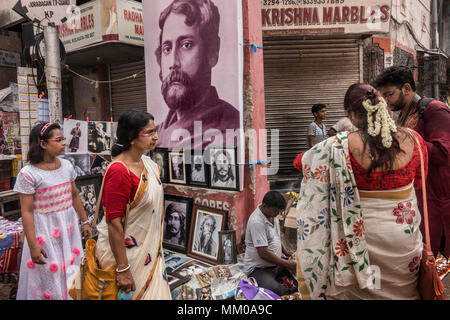 Kolkata. 9th May, 2018. Indian people buy pictures of Rabindranath Tagore during the celebration of his 157th birth anniversary in Kolkata, India on May 9, 2018. Tagore was the first Asian to win Nobel Prize for his collection of poems 'Geetanjali' in 1913. Credit: Tumpa Mondal/Xinhua/Alamy Live News Stock Photo