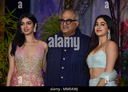 Indian film producer Boney Kapoor with his younger daughters Khushi Kapoor and Janhvi Kapoor attend the wedding reception of actress Sonam Kapoor and Anand Ahuja at hotel Leela in Mumbai. Stock Photo