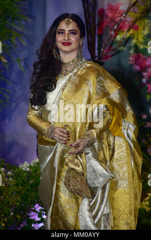 Indian film actress Rekha attend the wedding reception of actress Sonam Kapoor and Anand Ahuja at hotel Leela in Mumbai. Stock Photo