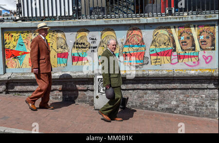 Brighton UK 9th May 2018 - Renowned artists Gilbert (right) and George took a walk around the streets of Brighton before visiting their own exhibition at Brighton Museum and Art Gallery which is showing until September until September .  Photograph taken by Simon Dack Credit: Simon Dack/Alamy Live News Stock Photo